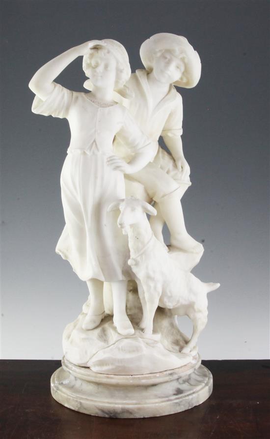 A late 19th century carved alabaster group of two children with a goat, 21in.